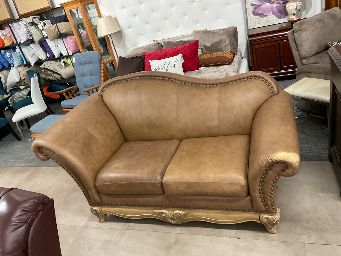 Leather Loveseat On Ornate Wood Base