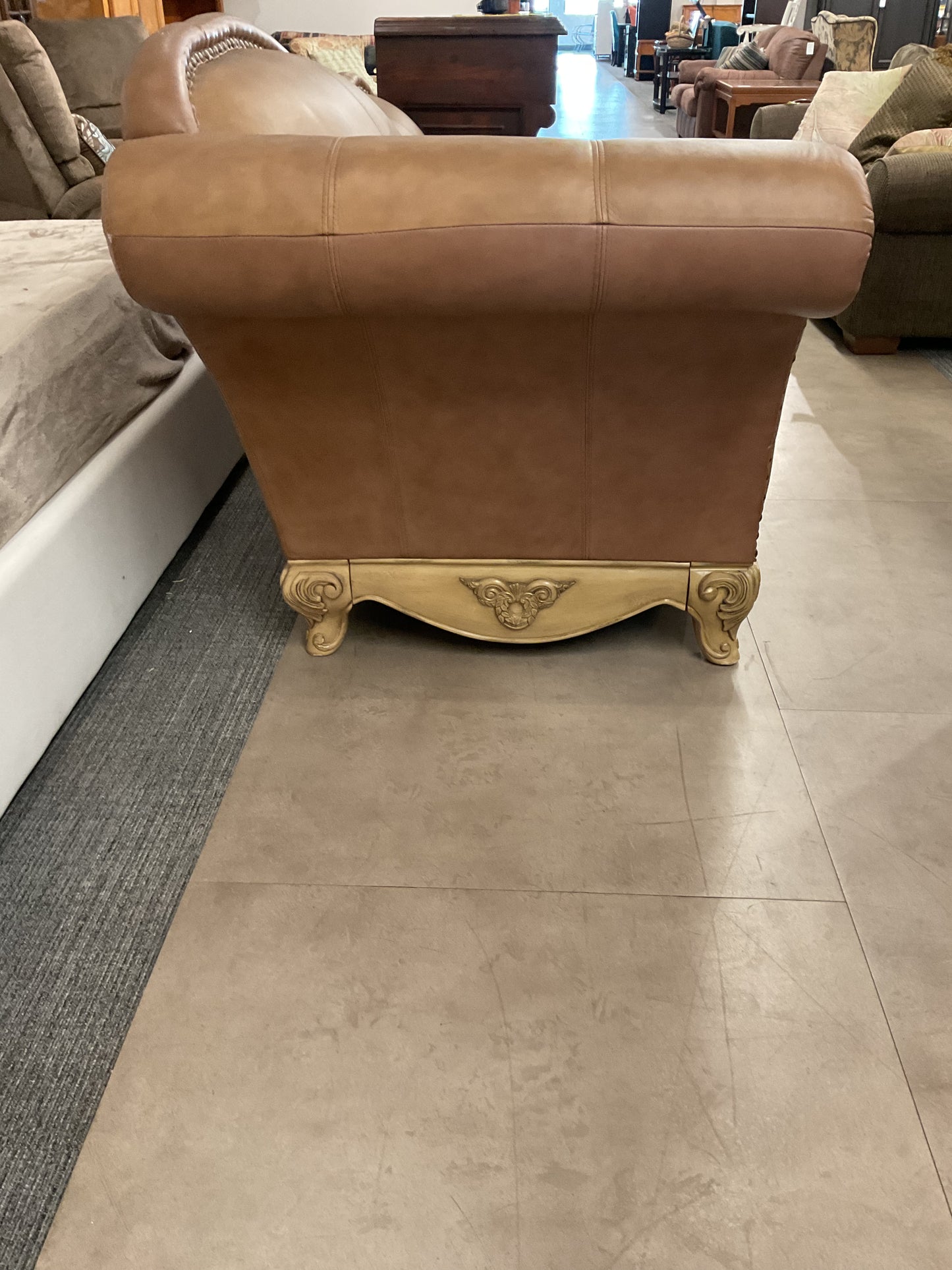 Leather Loveseat On Ornate Wood Base